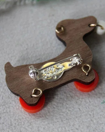 DOG ON WHEELS BROOCH