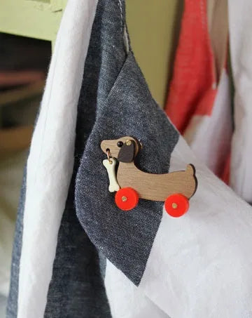 DOG ON WHEELS BROOCH